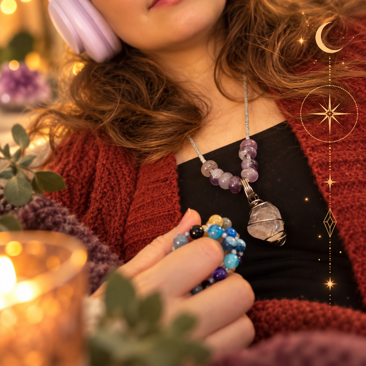 Woman wearing lavender headphones and holding colourful crystal mala beads, with a handmade crystal pendulum necklace, in a warm, candlelit setting with celestial details.